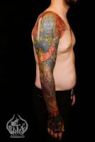Tatuaje japonés de un ogro guerrero en el brazo