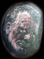 Tatuaje de una cara agresiva