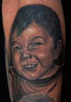 Tatuaje de la cara de un niño
